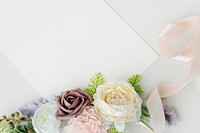 Blank white card decorated with flowers
