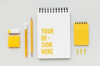 Set of yellow stationery on workspace