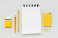 Set of yellow stationery on workspace