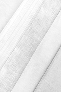 Stack of folded gray and white woven fabric patterned background