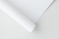 Blank white rolled chart paper on a gray background