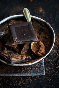 Closeup of dark chocolate and cacao in a bowl. Visit <a href="https://monikagrabkowska.com/" target="_blank">Monika Grabkowska</a> to see more of her food photography.