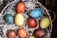 Colored Easter eggs in a basket. Visit <a href="https://monikagrabkowska.com/" target="_blank">Monika Grabkowska</a> to see more of her food photography.