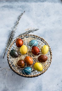 Colored Easter eggs in a basket. Visit Monika Grabkowska to see more of her food photography.