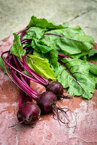 Closeup of washed beetroots on a table. Visit <a href="https://monikagrabkowska.com/" target="_blank">Monika Grabkowska</a> to see more of her food photography.