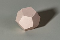 3D pink pentagon shaped paper craft on a gray background 