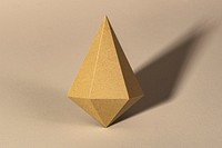 3D golden asymmetric hexagonal bipyramid paper craft on a beige background