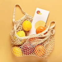 Flyer in a reusable net bag with fruits