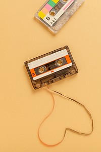 Old school cassette tape on a beige background 