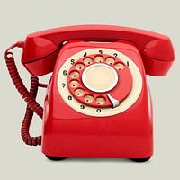 Vintage red telephone on beige background