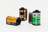 Three rolls of analog 35mm film on a white background. JANUARY 29, 2020 - BANGKOK, THAILAND