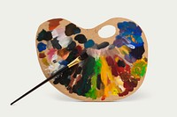 Wooden palette with paint brush