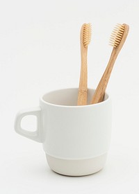 Natural bamboo toothbrush in a cup