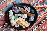 Sage and crystals on a ceramic plate ready for smudging