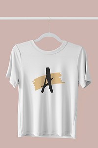 White t-shirt hanging on a clothing rack