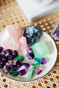 Colorful healing crystals on a ceramic plate