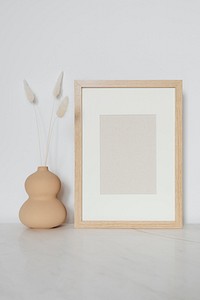 Rectangle wooden photo frame on the floor