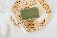 Flat lay natural handmade soap bars with grass flowers in spa compostition