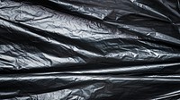 Disposable black garbage bag texture 