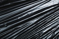 Disposable black garbage bag texture 