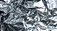 Crumpled aluminum foil textured background