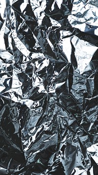 Crumpled aluminum foil textured background