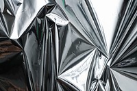 Crumpled aluminum foil textured background