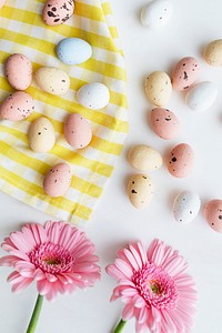 Chocolate Easter eggs and pink gerbera flatlay