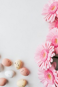 Chocolate Easter eggs and pink gerbera flowers flatlay