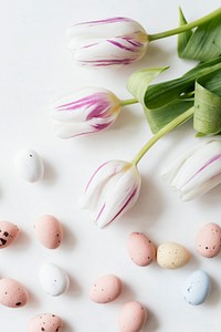 Chocolate Easter eggs and tulips flatlay