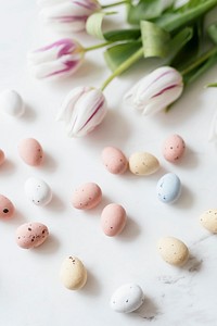 Chocolate Easter eggs and tulips flatlay