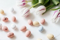 Chocolate Easter eggs and tulips flatlay