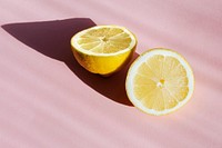 Fresh lemon on pink background