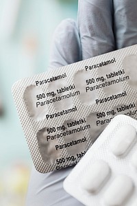 Pharmacist holding paracetamol pain killers