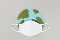 Paper craft planet earth wearing a face mask due to COVID-19 illustration