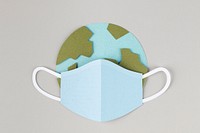 Paper craft planet earth wearing a face mask due to COVID-19 illustration