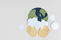 Hands washing the planet earth paper craft background