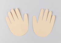 Human hands paper craft on a gray background
