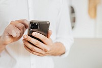 Businessman checking his social media account and messages on a phone