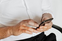 Businessman checking his social media account and messages on a phone
