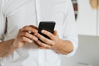 Businessman checking his social media account and messages on a phone