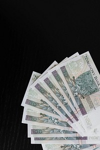 Polish Zloty banknotes on a black background