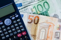 Calculator and Euro banknotes on a table