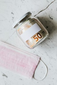 Money savings in a jar during the COVID-19 pandemic