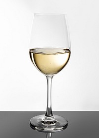 Glass of white wine on white background