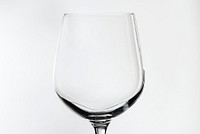 Empty red wine glass isolated on background