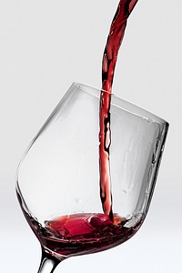 Red wine glass mockup with wine pouring in