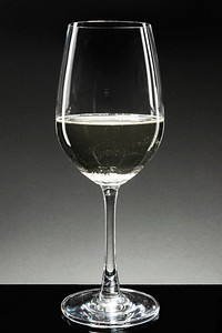 White wine in a wine glass on dark background