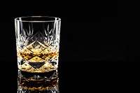 Golden scotch whisky on a black background