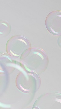 Transparent soap bubble pattern on a gray mobile screen background